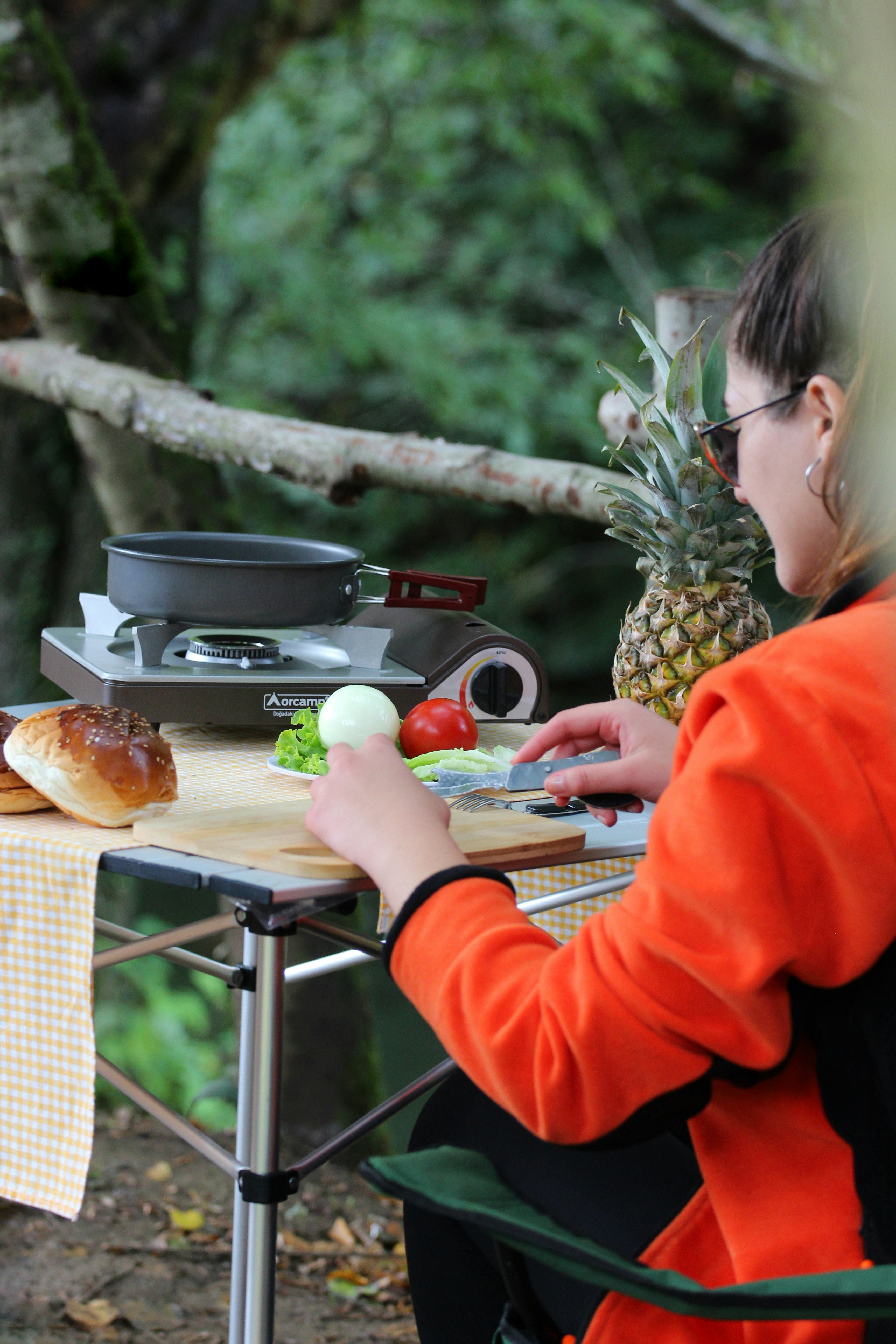 Preparing to cook a meal in the outdoors.